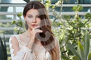 Sexy beautiful woman bride evening party makeup pure natural skin care cosmetic healthy curly brunette hair manicure hand wear