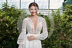 Sexy beautiful woman bride evening party makeup pure natural skin care cosmetic healthy curly brunette hair manicure hand wear