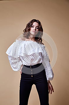 Sexy beautiful woman fashion glamour model brunette hair makeup wear silk blouse trousers clothes for every day casual party style