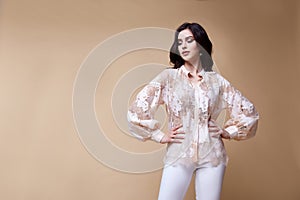 Sexy beautiful woman fashion glamour model brunette hair makeup wear silk blouse trousers clothes for every day casual party style