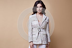 Sexy beautiful woman fashion glamour model brunette hair makeup wear silk blouse trousers jacket clothes for every day casual