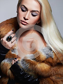 beautiful Woman in Fur Coat. winter Beauty Fashion Model Girl