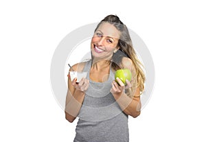 beautiful woman holding green apple fruit in healthy natural nutrition and fitness concept