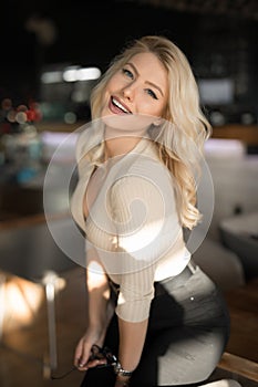 Sexy beautiful woman posing in cafe like model