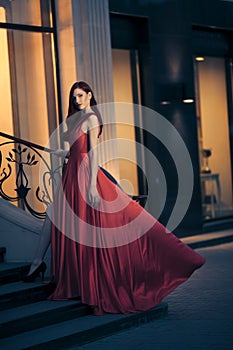 beauty woman in fluttering red dress
