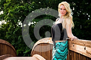 blonde fashion model on a bridge