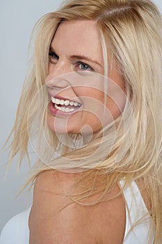 blonde model turning back and laughing