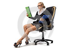 blonde secretary sitting in the office chair