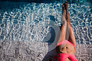 body of beautiful woman. Girl relaxing in a poll at summer.