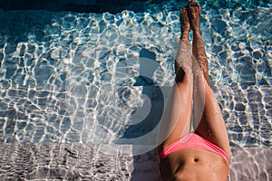 body of beautiful woman. Girl relaxing in a poll at summer.