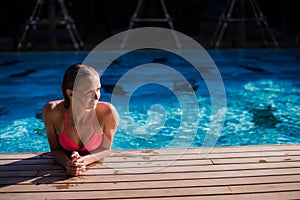 body of beautiful woman. Girl relaxing in a poll at summer.