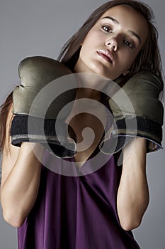 brunette in boxing gloves