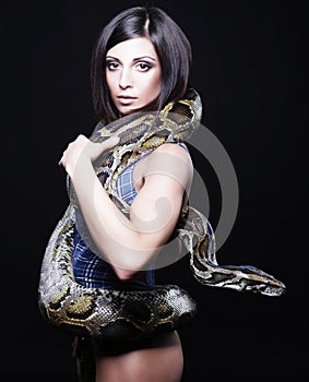 brunette holding python