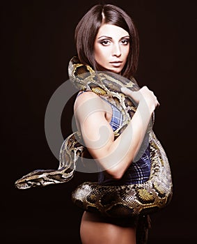 brunette holding python