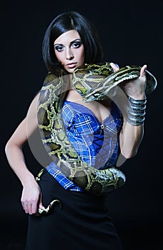 brunette holding python