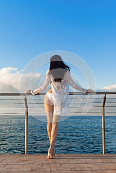 brunette woman in white bikini