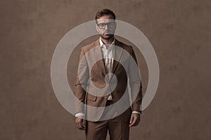 Businessman wearing a nice brown suit and eyeglasses