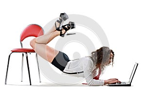 businesswoman lying on chair with laptop