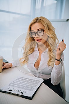 sexy businesswoman reading working