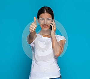 Sexy casual woman giving a thumbs up