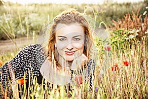 caucasian woman and corn poppy flowers, beauty filter