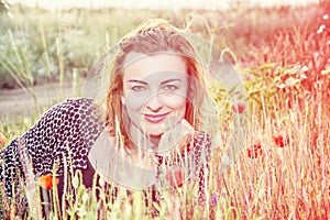 caucasian woman and corn poppy flowers, beauty filter