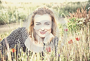 caucasian woman and corn poppy flowers, beauty filter