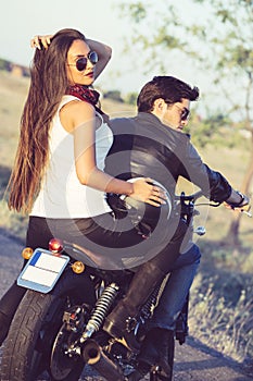 couple of bikers on the vintage custom motorcycle