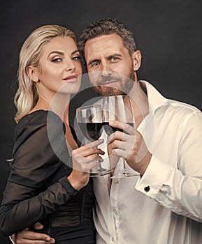 sexy couple in love of woman and man with wine glass embrace and celebrate spacial occasion, date