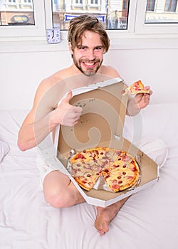 courier delivers gastronomic satisfaction. Gastronomic satisfaction. Man bearded handsome eat pizza. Man eat pizza