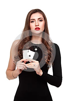 curly hair brunette posing with two aces cards in her hands, poker concept isolation on white background