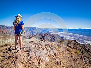 Sexy curvy woman on top of Dante`s View in Death Valley, California, USA