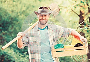 Sexy farmer hold shovel and box with pot. muscular ranch man in cowboy hat. farming and agriculture. Garden equipment