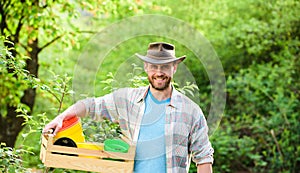 Sexy farmer hold wooden box with pot. Eco farm worker. Harvest. happy earth day. Eco living. farming and agriculture