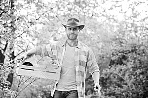 Sexy farmer hold wooden box with pot. farming and agriculture cultivation. Garden equipment. Eco farm worker. Harvest