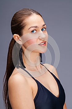 Sexy fashion brunette woman in black bathing suit