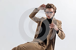 Sexy fashion guy wearing smart casual outfit and posing in a cool way