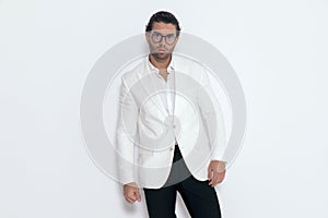sexy fashion guy wearing white jacket suit and open collar shirt