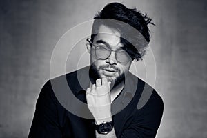 fashion man model dressed casual wearing glasses posing dramatic against grunge wall