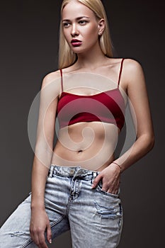 fashion model with long hair, young European attractive, beautiful eyes, full lips, perfect skin is posing in studio for gla