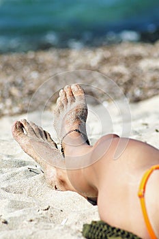 foot of a woman with an anklet photo