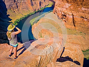 Sexy girl admires panorama of Horseshoe Bend, Page Arizona, The Colorado River