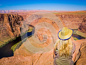Sexy girl admires panorama of Horseshoe Bend, Page Arizona, The Colorado River