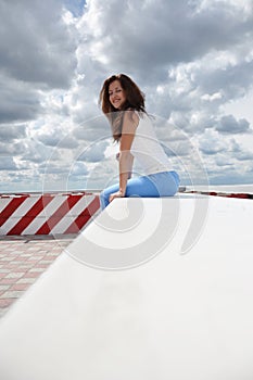 Sexy girl on dramatic sky background. weather forecast. happy woman relax on viewpoint. summer holiday and vacation. female spring