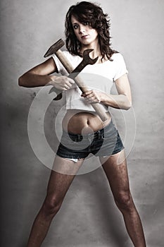 girl holding hammer and wrench spanner