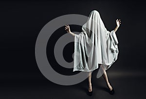 Sexy Girl with long legs in costume Spooky white ghost. Halloween minimal concept