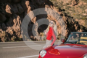 sexy girl model and red convertible sports car