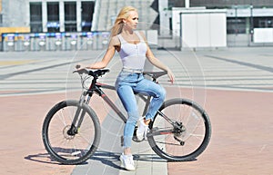 Sexy girl with perfect body on black bike