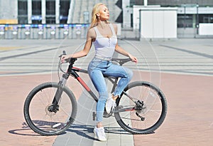 Sexy girl with perfect body on black bike