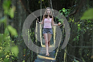 girl on the rope bridge